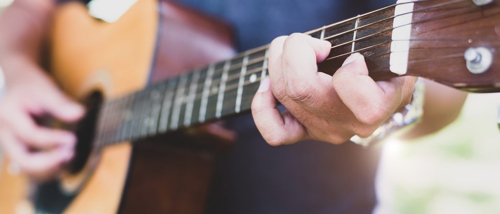 person playing a guitar