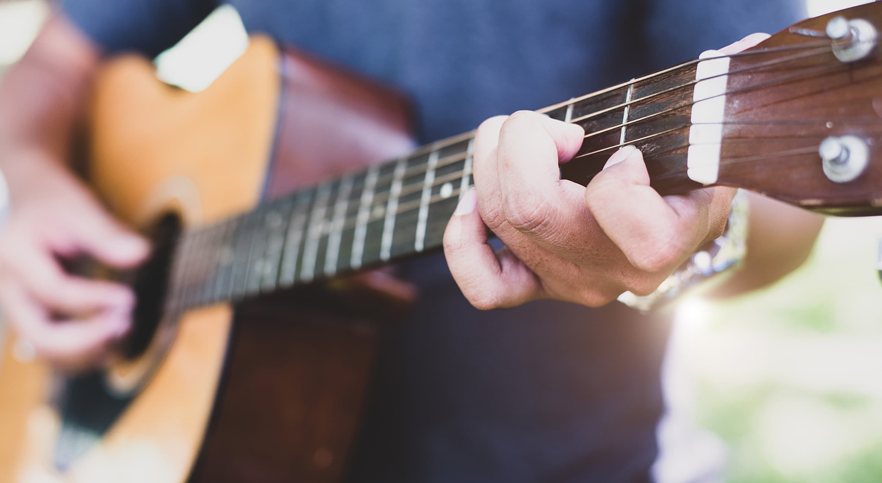 person playing a guitar