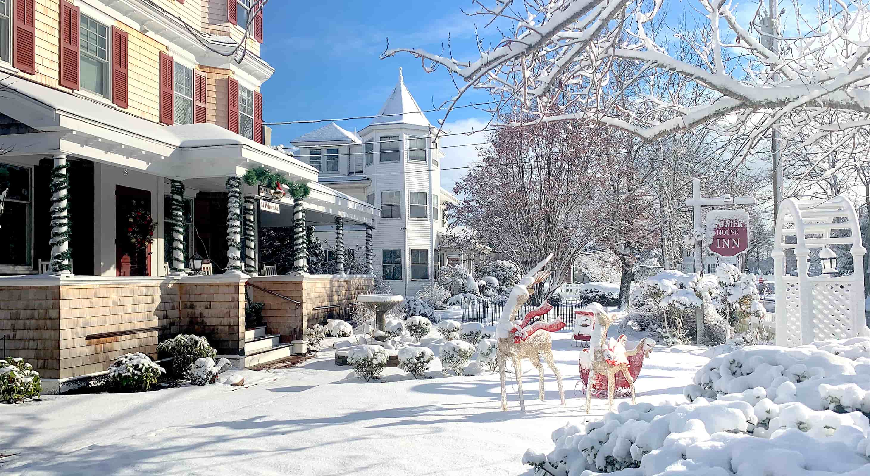 Palmer House Inn covered in snow on a sunny winter day