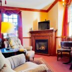 Emily Dickinson Room sitting area with fireplace
