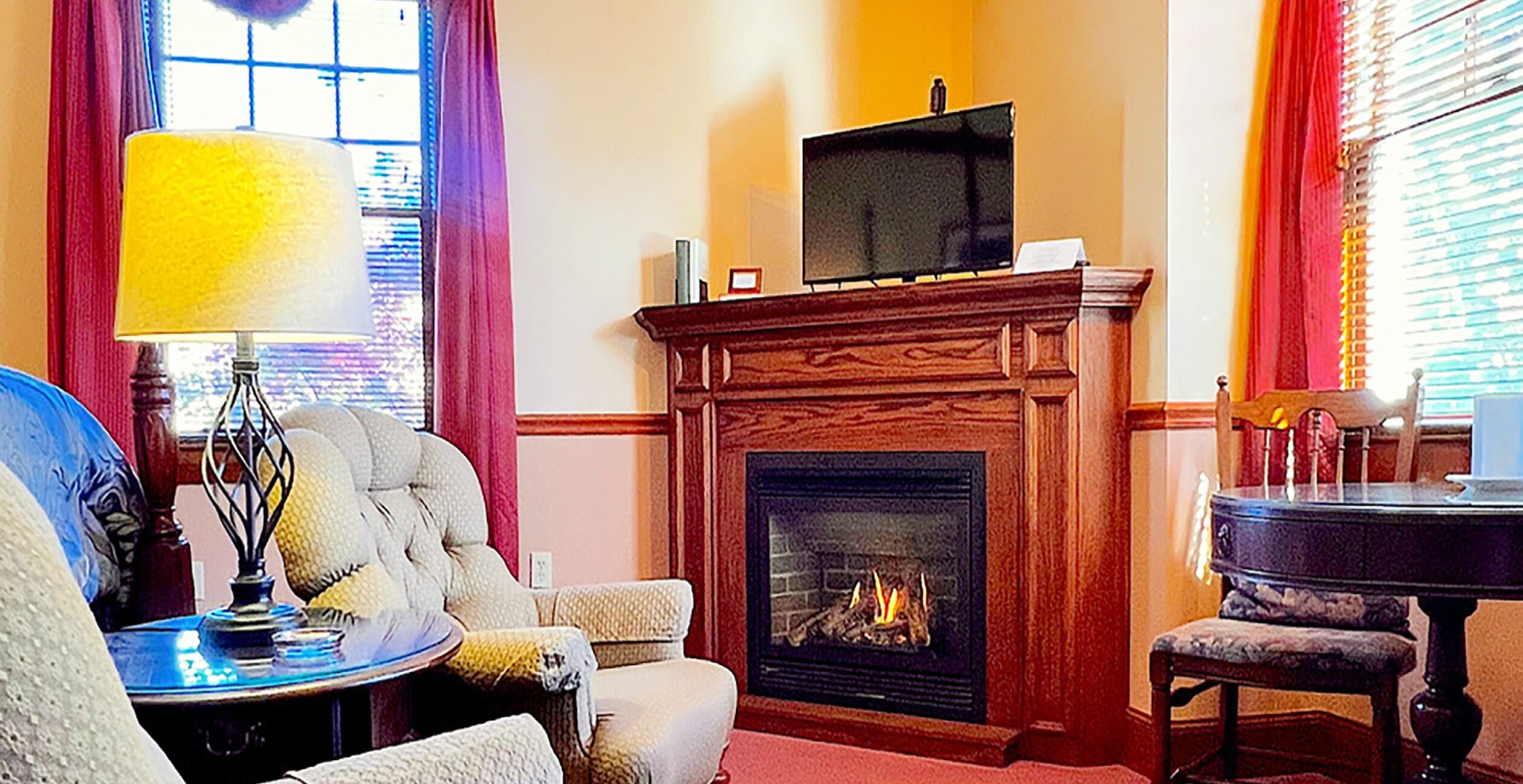 Emily Dickinson Room sitting area with fireplace