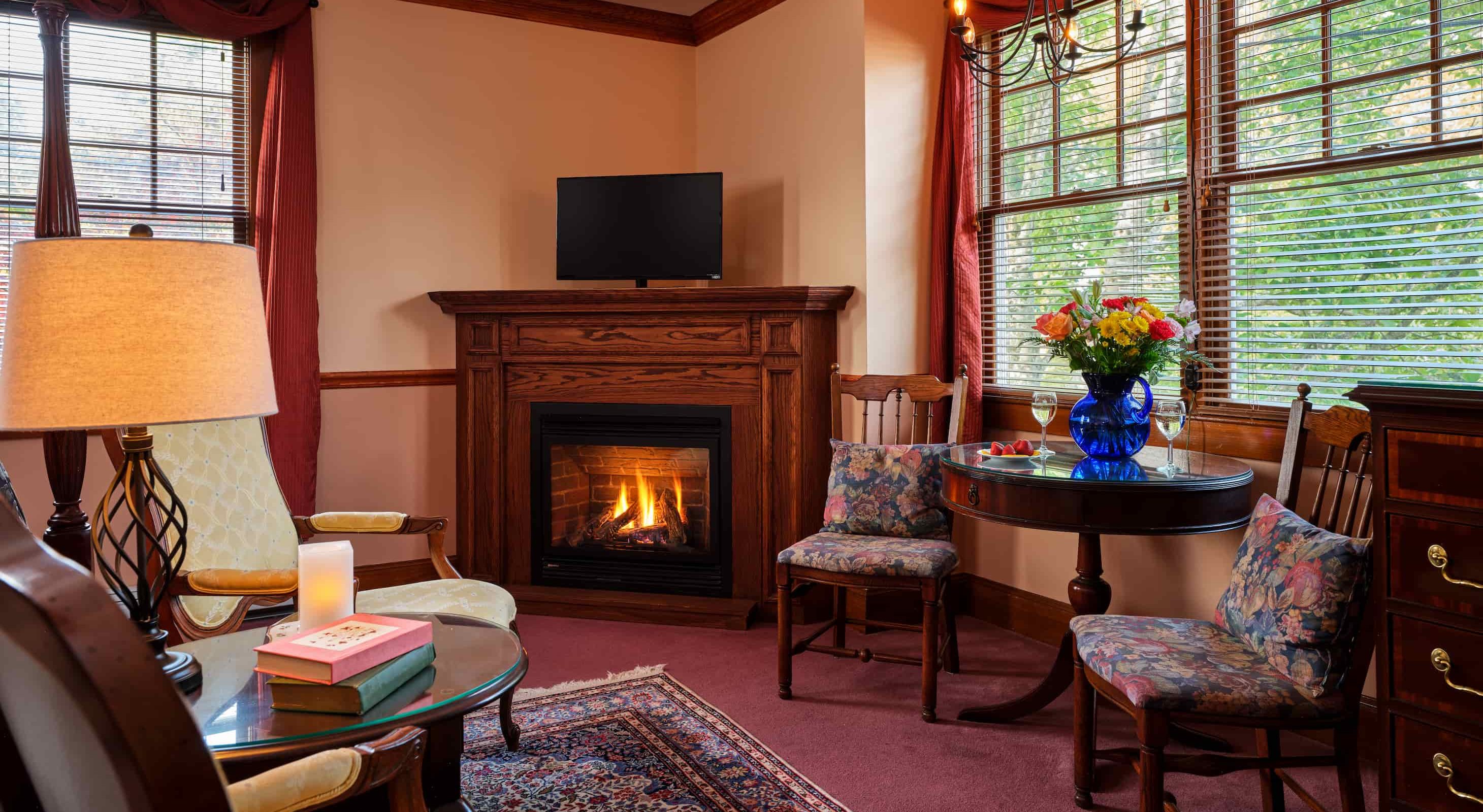 Emily Dickinson Room sitting area with fireplace