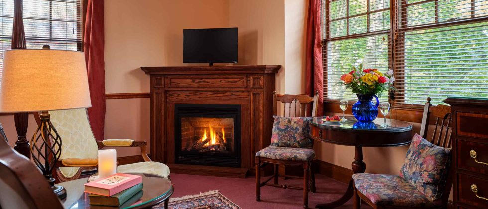 Emily Dickinson Room sitting area with fireplace