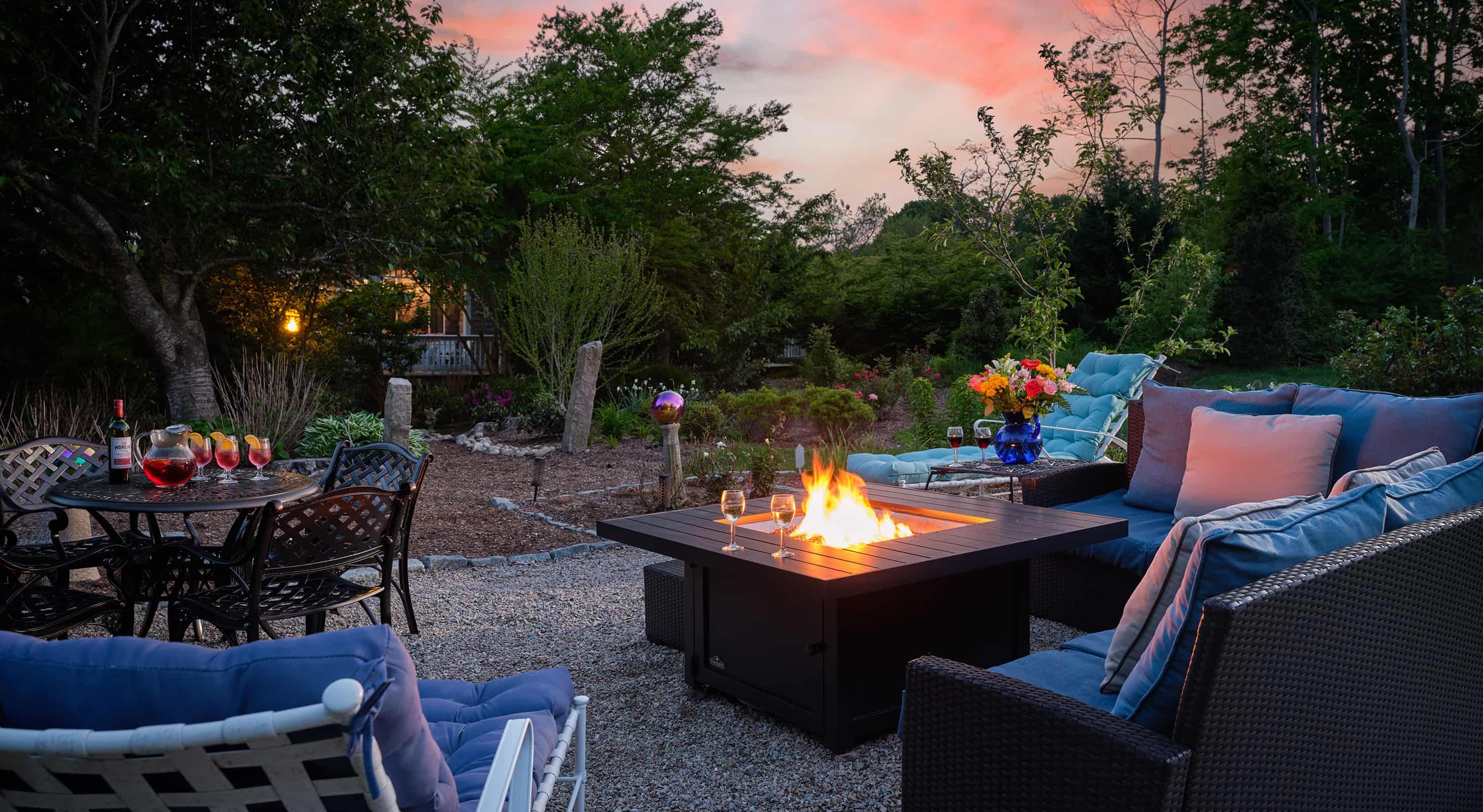 Chairs around firepit at dusk