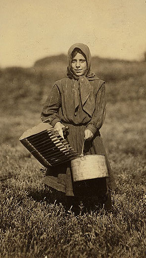 Carrie Maderyos, 12 years old, ready to pick at Swifts Bog, Falmouth, 1911. Photo courtesy the Library of Congress. 