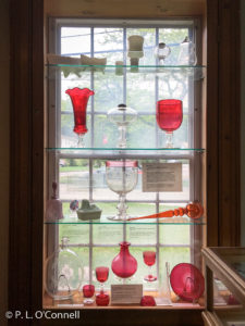 Red Glass Display at the Sandwich Glass Museum in Sandwich, Massachusetts, USA.