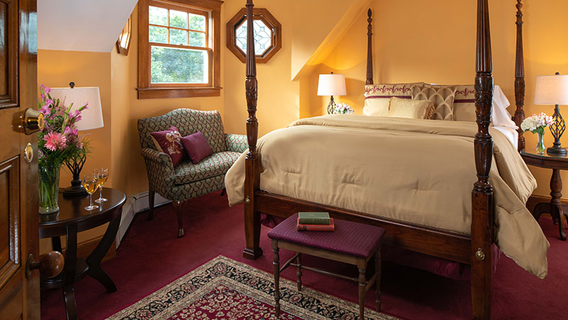 Cozy guest room at Palmer House Inn