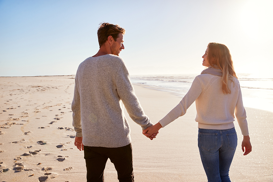 couple walking down the beach on Cape Cod