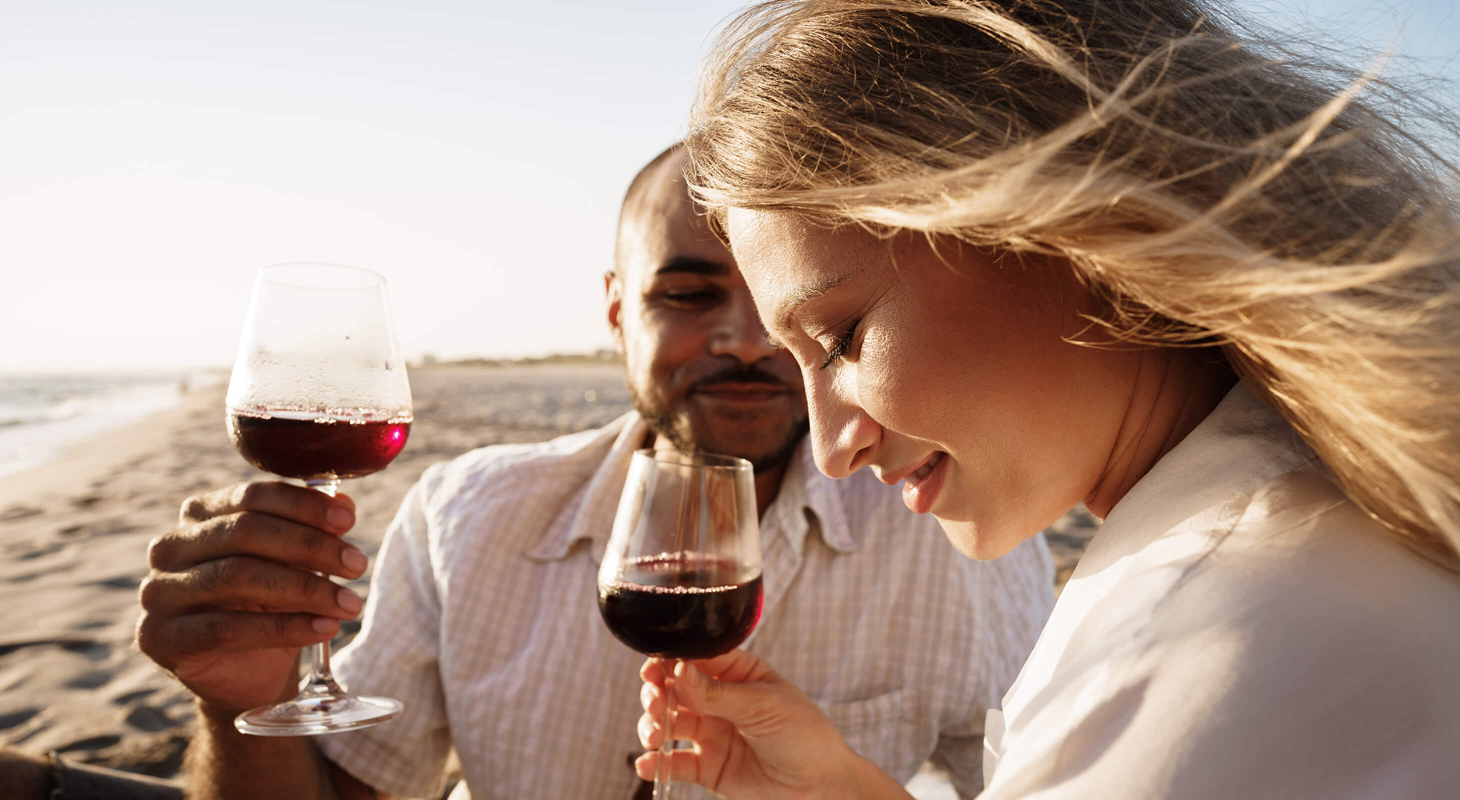 A one-line drawing romantic couple enjoying a glass of red wine in a scenic  vineyard landscape