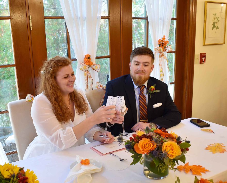 Bride and groom toasting Champagne at their reception at the Palmer House Inn