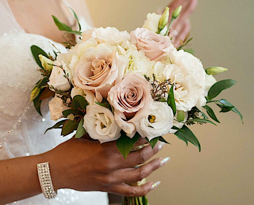 Bride with pink and white wedding bouquet