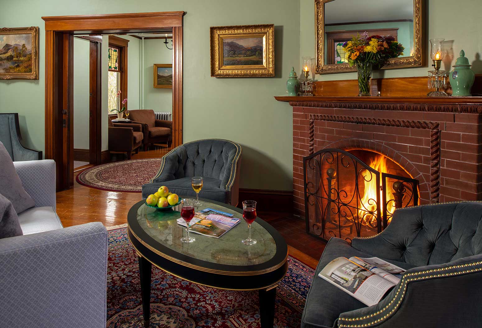 Comfortable common rom sitting area and fireplace at inn on Cape Cod