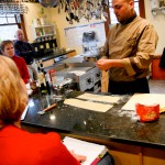 Chef Pozzati demonstraiting the use of a pasta tool.