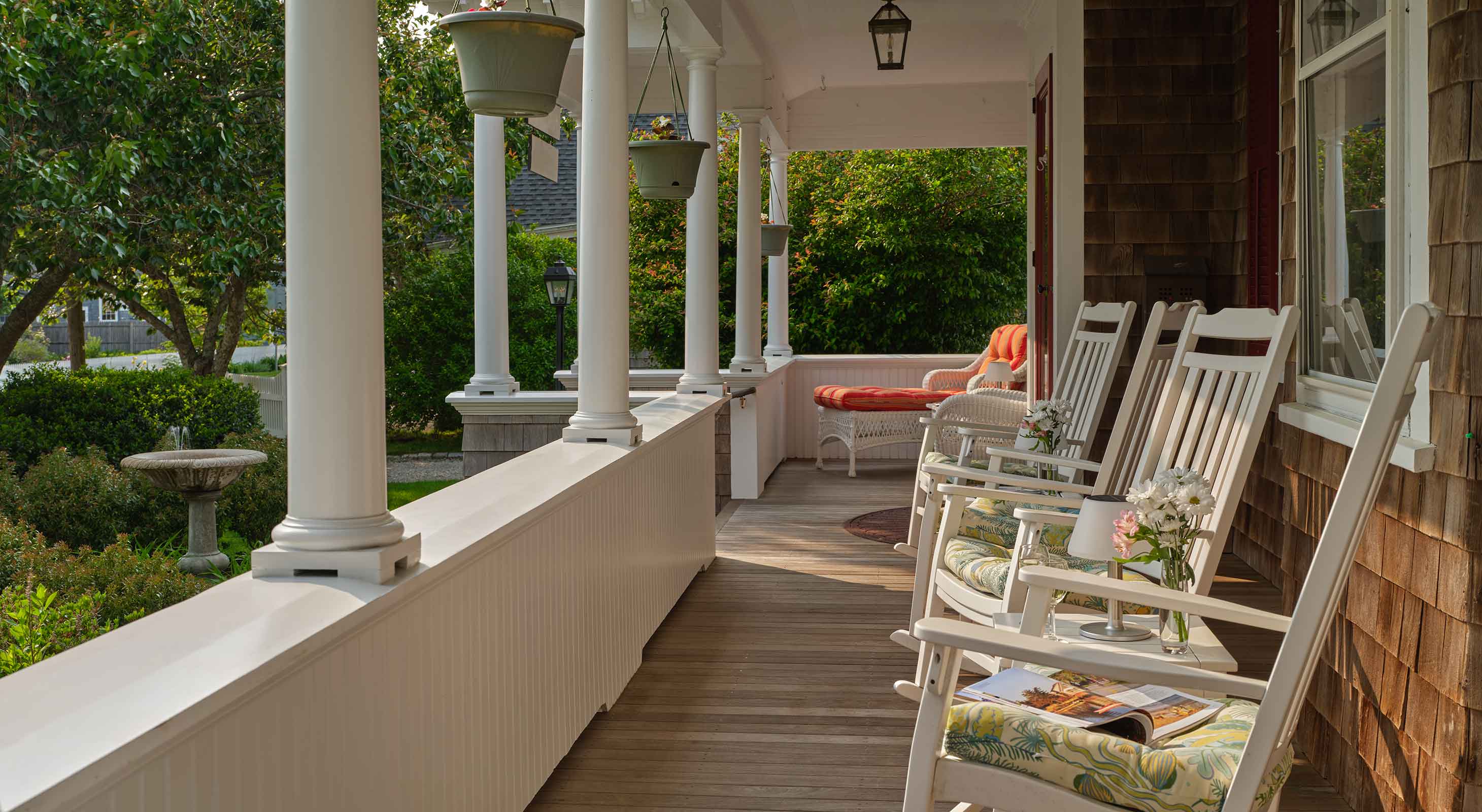 Front porch with columns and rocking chairs