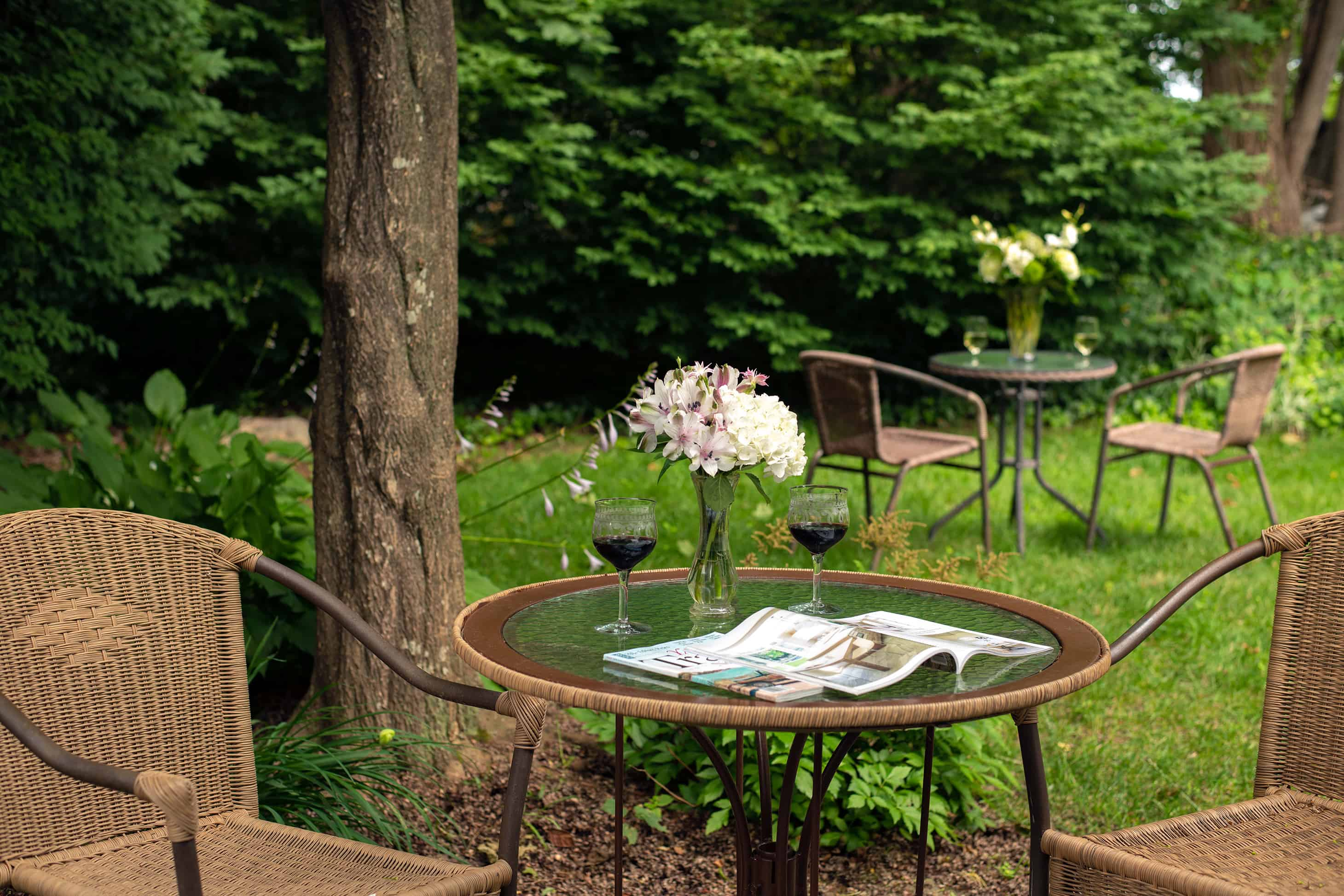 Falmouth, MA accommodations with table sitting area in the gardens