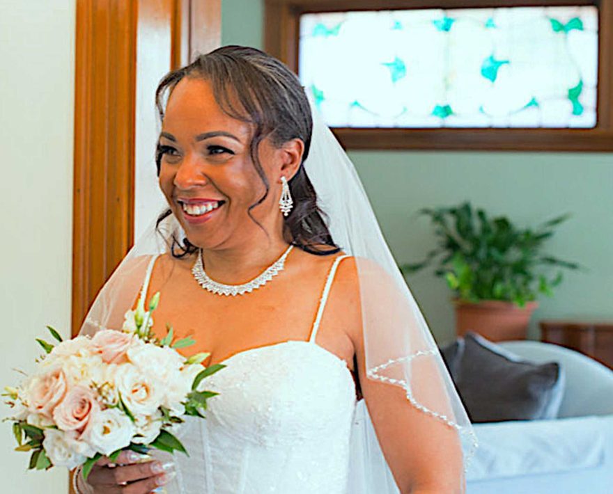 Happy bride with wedding bouquet