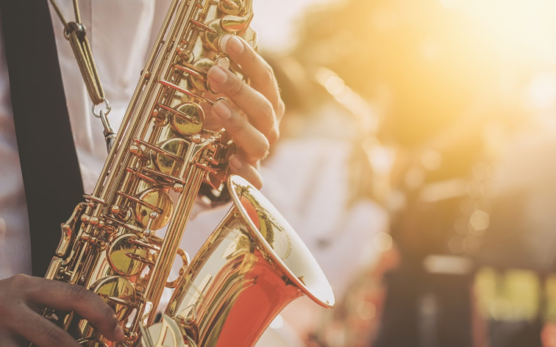 a man playing a saxaphone