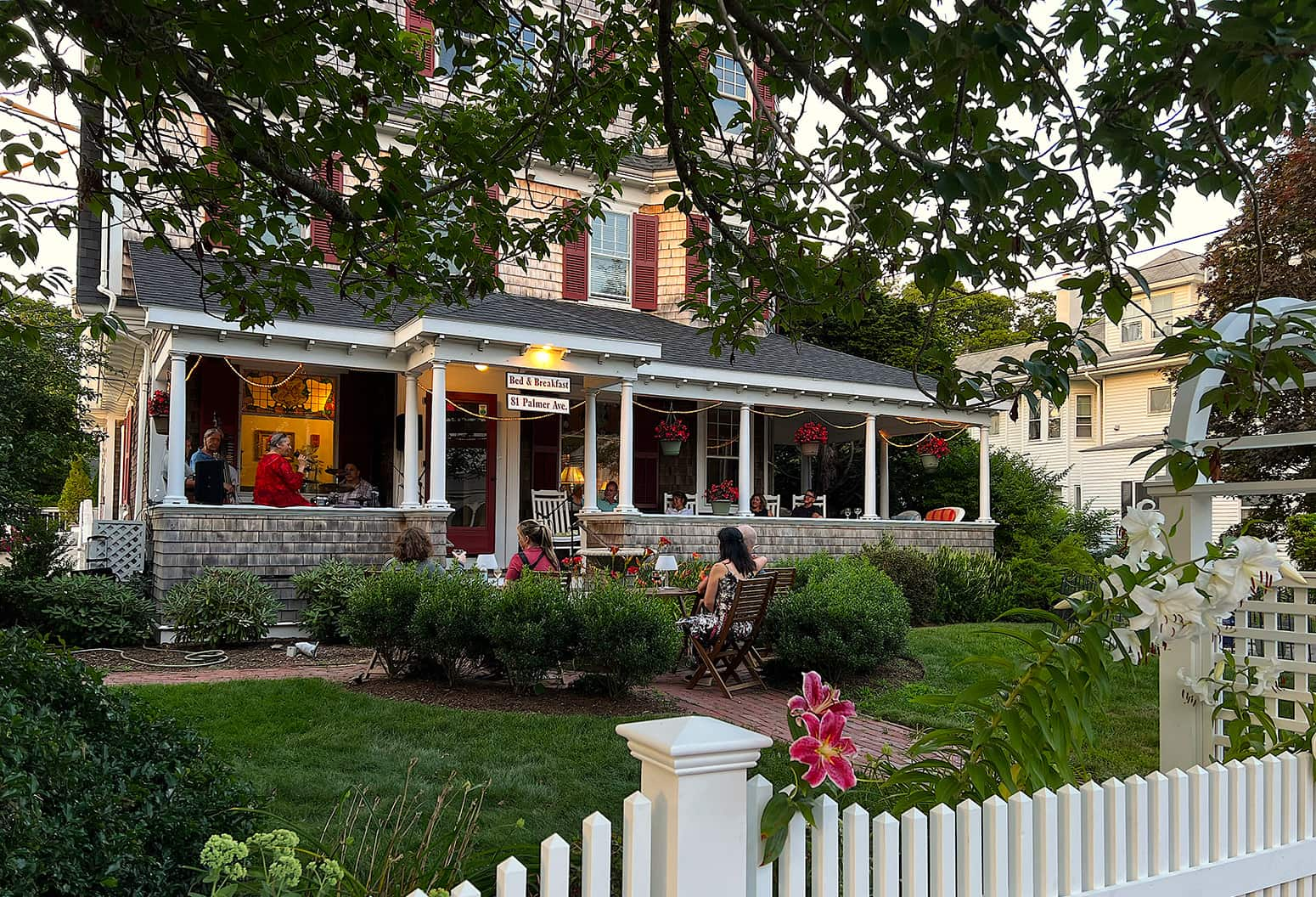 people relaxing in front of Cape Cod bed and breakfast