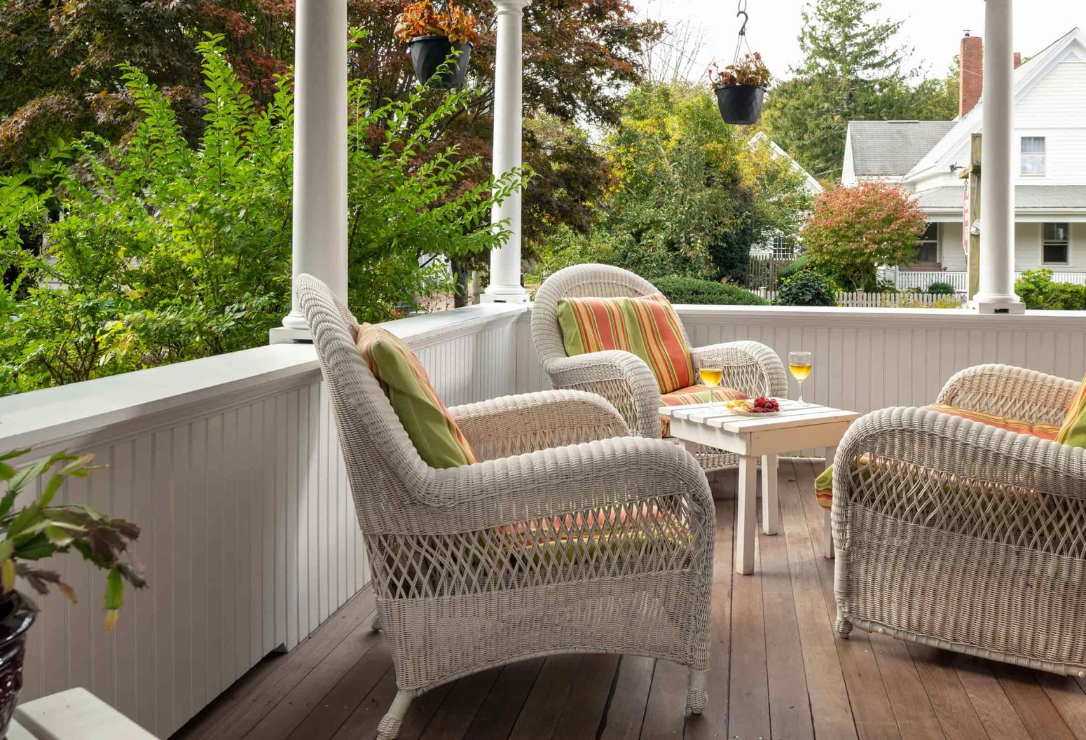 Wrap-around porch with wicker chairs