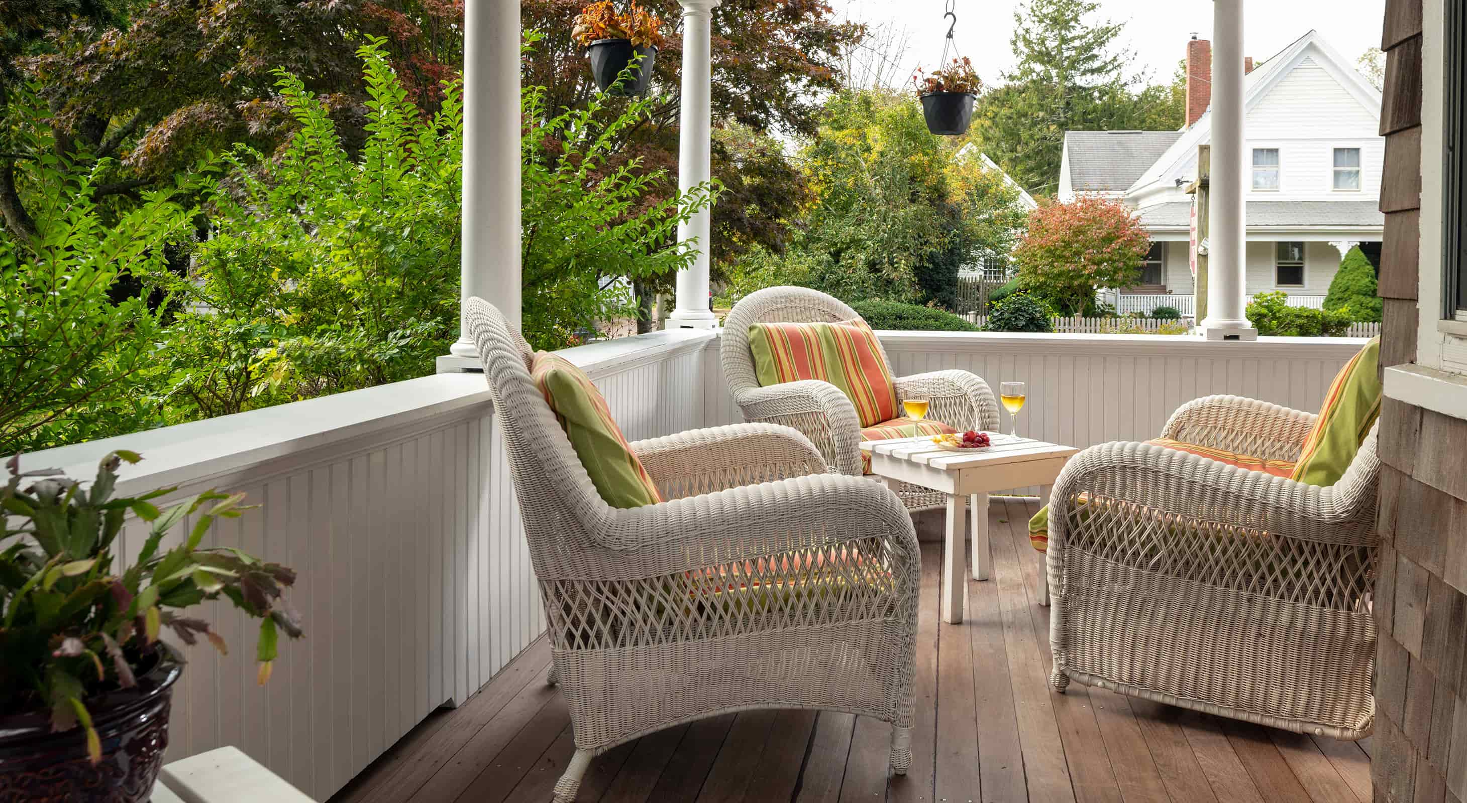 Wrap-around porch with wicker chairs