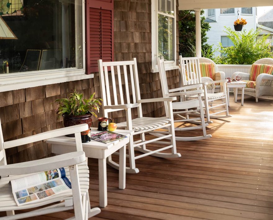 white rocking chairs on the front porch