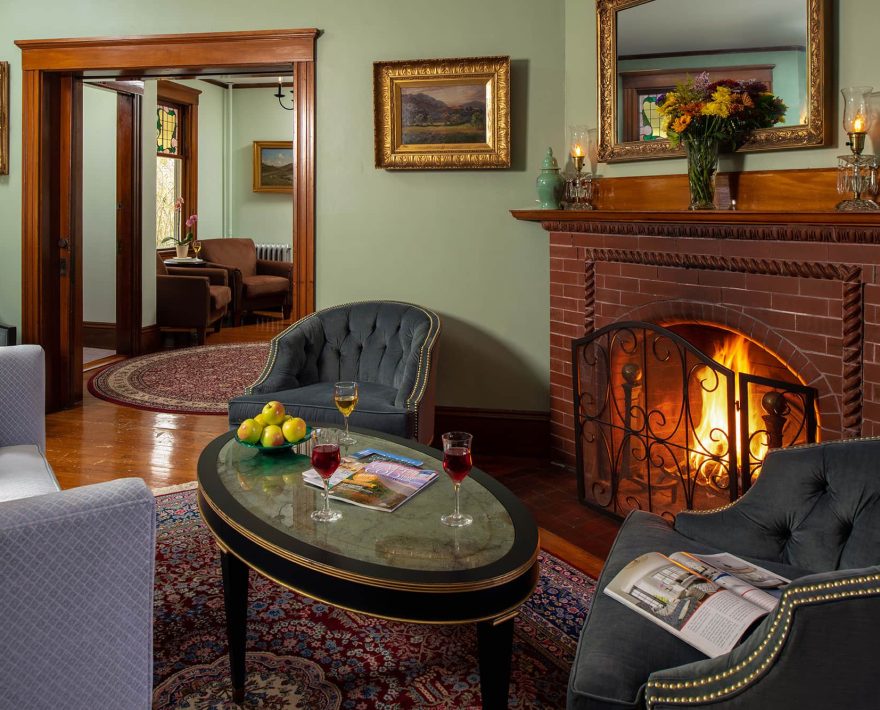 Comfortable common rom sitting area and fireplace at inn on Cape Cod