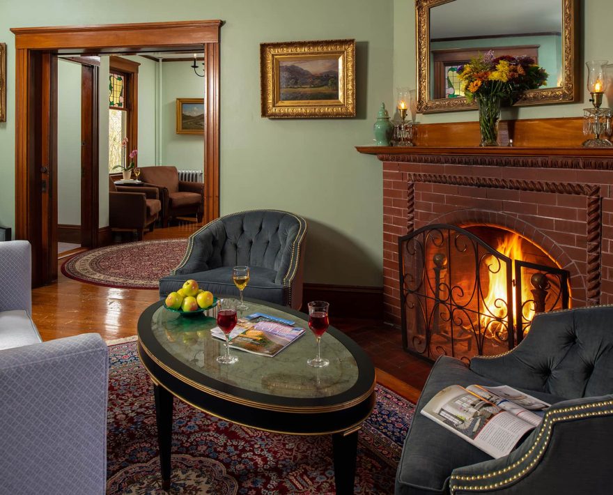 Comfortable common rom sitting area and fireplace at inn on Cape Cod