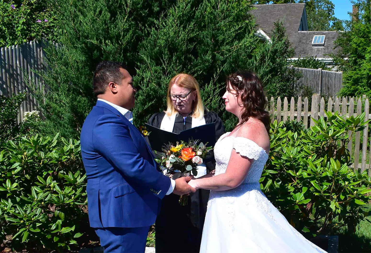 Couple and minister getting married at Falmouth, MA elopement venue
